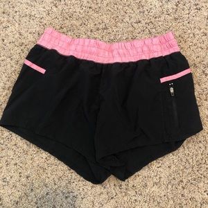 Black and pink athletic shorts